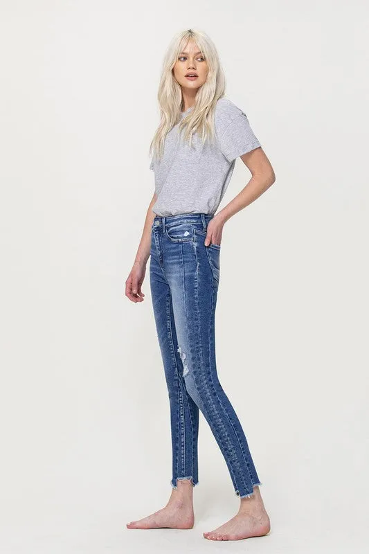 HIGH RISE ANKLE SKINNY W UNEVEN HEM DETAIL