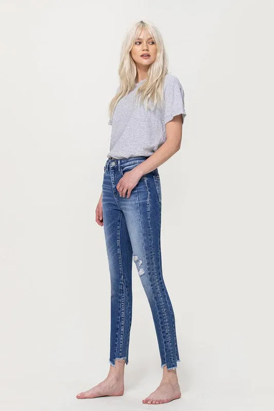 HIGH RISE ANKLE SKINNY W UNEVEN HEM DETAIL