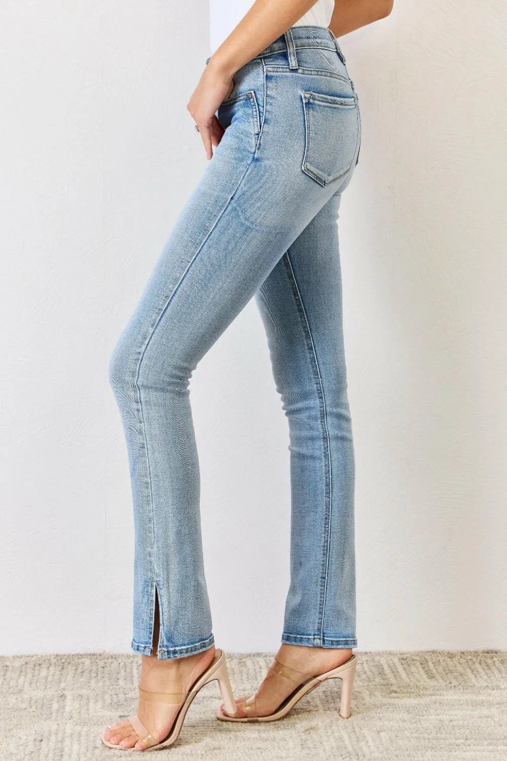 Kancan Full Size Mid Rise Y2K Slit Bootcut Jeans in light denim