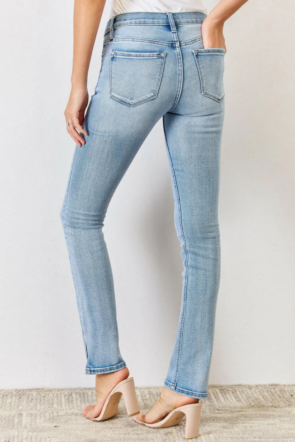 Kancan Full Size Mid Rise Y2K Slit Bootcut Jeans in light denim