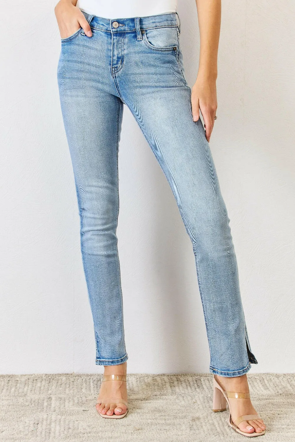 Kancan Full Size Mid Rise Y2K Slit Bootcut Jeans in light denim